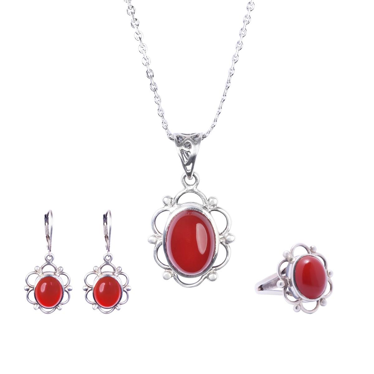 A silver necklace, pair of earrings and ring, each set with an oval red carnelian.