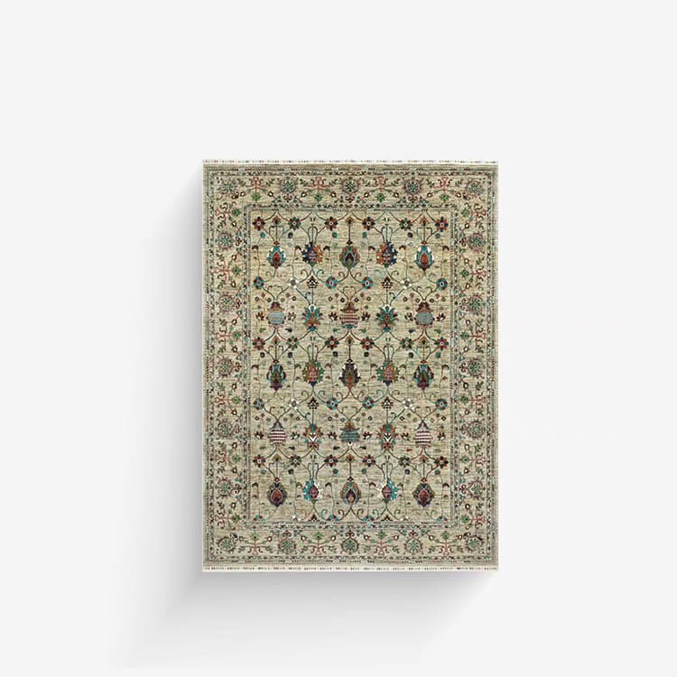 An ivory hand-knotted rug with rows of small red, green and blue floral motifs.